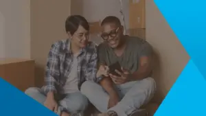 Couple looking at cell